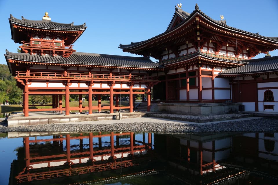 Byodo-In Temple in Uji, Kyoto, Japan, reflecting beautifully in a tranquil pond.