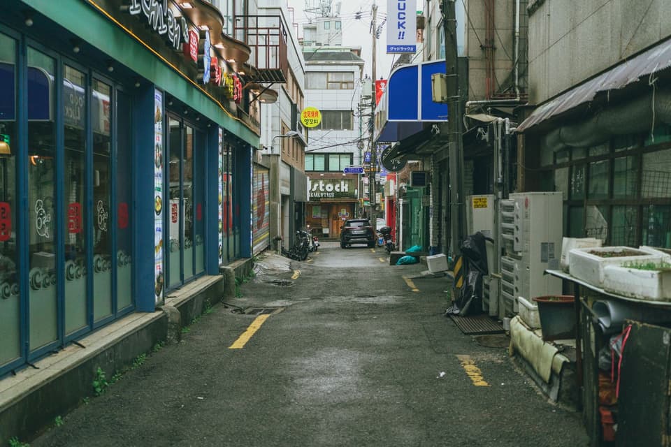 Explore a typical alleyway in Seoul, South Korea, showcasing local architecture and city life.