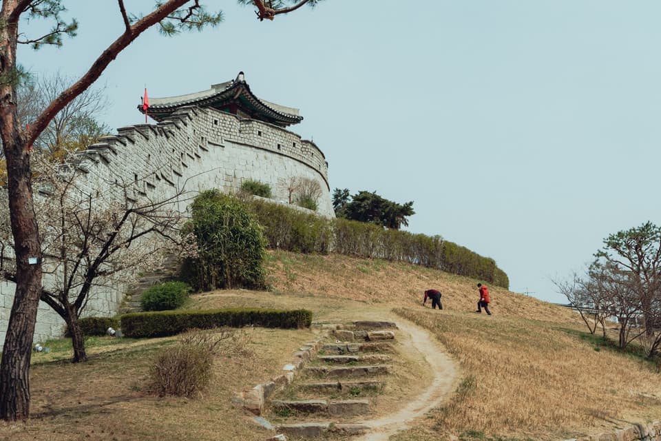 Explore the scenic view of a historic Korean fortress wall in Seoul, South Korea.