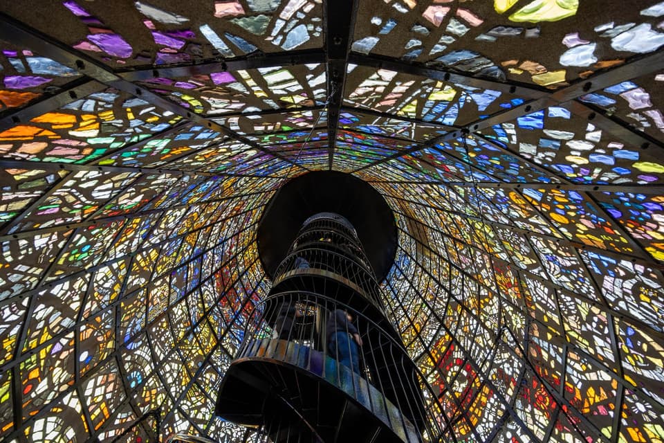 Stunning view from inside a colorful stained glass tower in Hakone, Japan.
