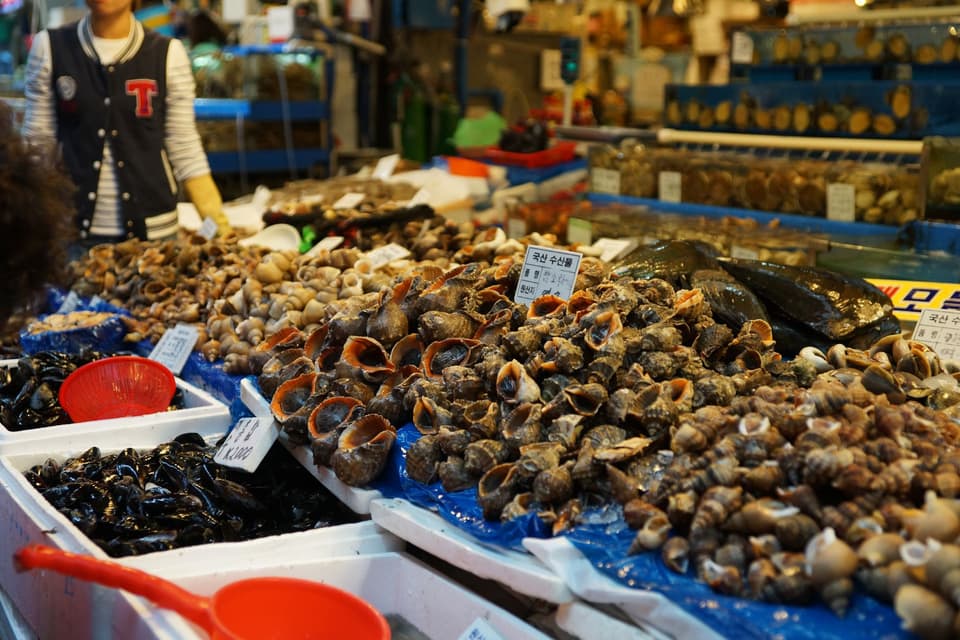 Seafood varieties on display at a bustling Hoengseong-gun market in Korea.