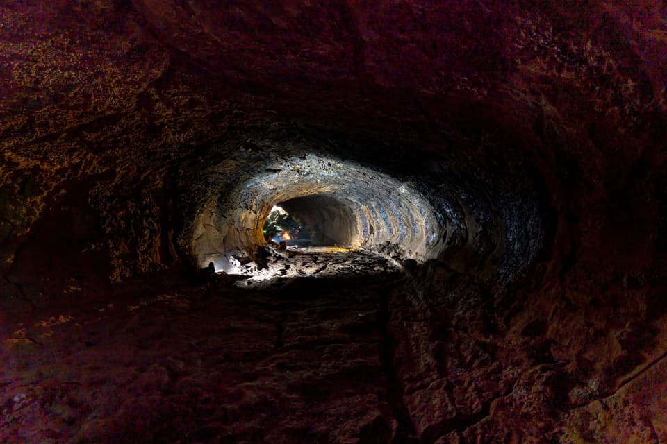 Explore the fascinating textures and formations inside a natural lava tube cave.
