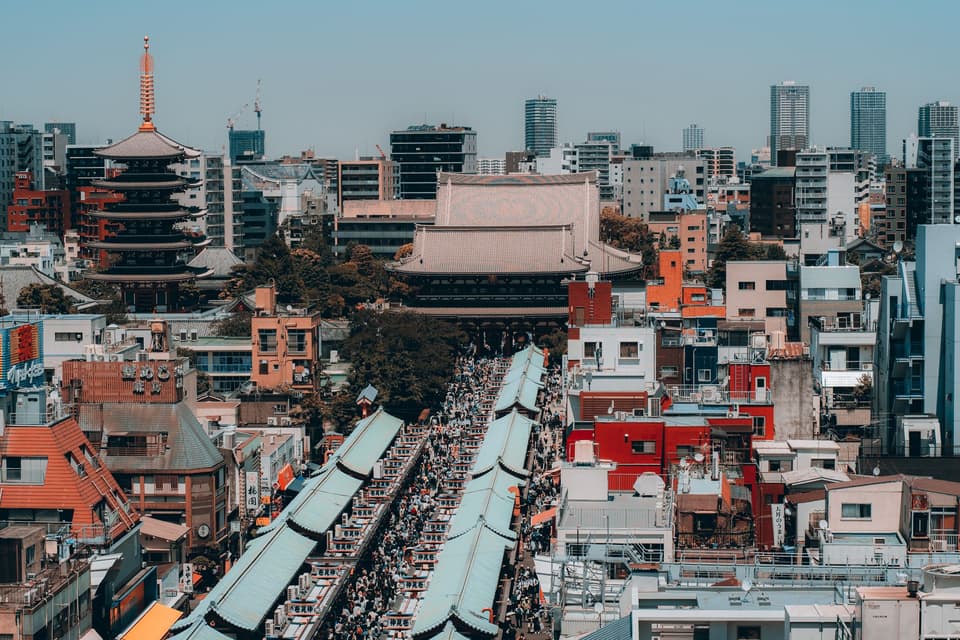 Explore the bustling Nakamise Shopping Street with iconic Asakusa temple backdrop in Tokyo, Japan.