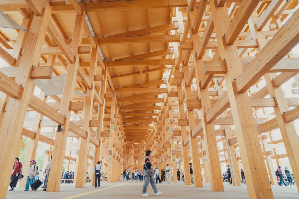 Explore the stunning wooden architectural structure in Osaka, blending traditional and modern elements.