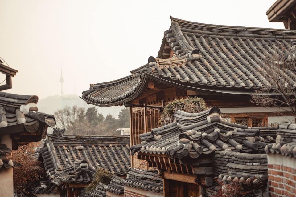 A charming view of traditional Hanok roofs in Seoul's historic Bukchon Hanok Village.