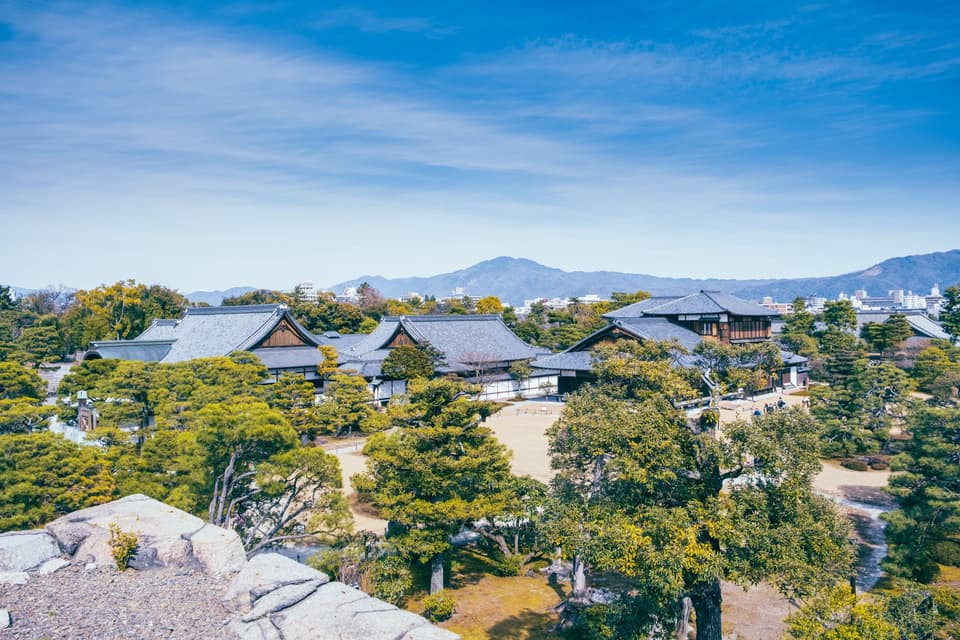 Explore the classic beauty of Nijo Castle in Kyoto, surrounded by lush gardens and historical architecture.