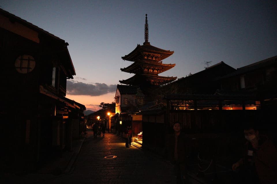 Serene evening view of Yasaka Pagoda in Kyoto's historic district at sunset.