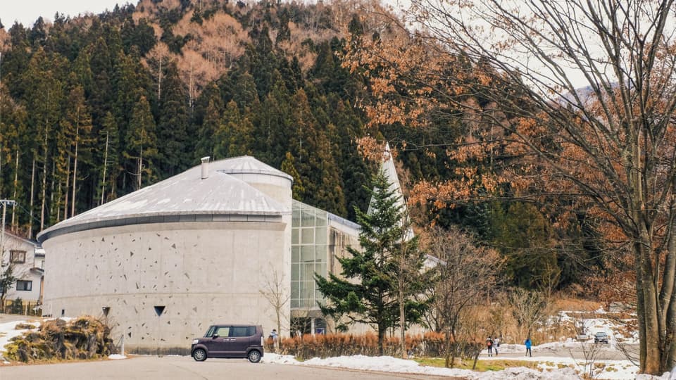 Discover the modern architecture of Shigakogen Roman Art Museum surrounded by autumn foliage in Yamagata, Nagano, Japan.