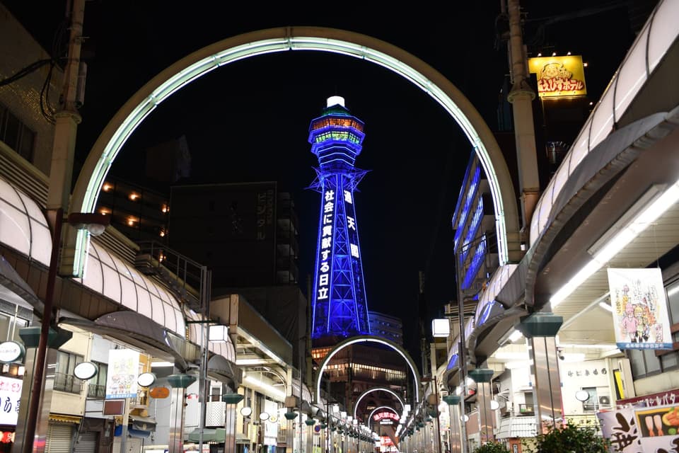 Vibrant night view of Tsūtenkaku Tower in Shinsekai, Osaka, Japan.