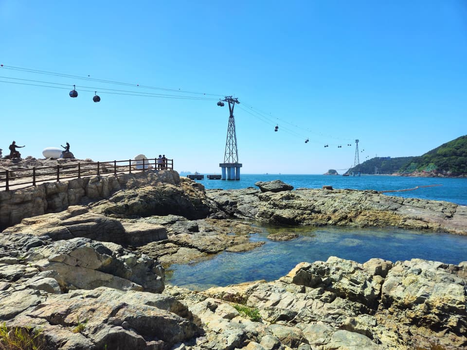 Discover the picturesque landscape of Songdo Cable Car over crystal clear waters in Busan, South Korea.