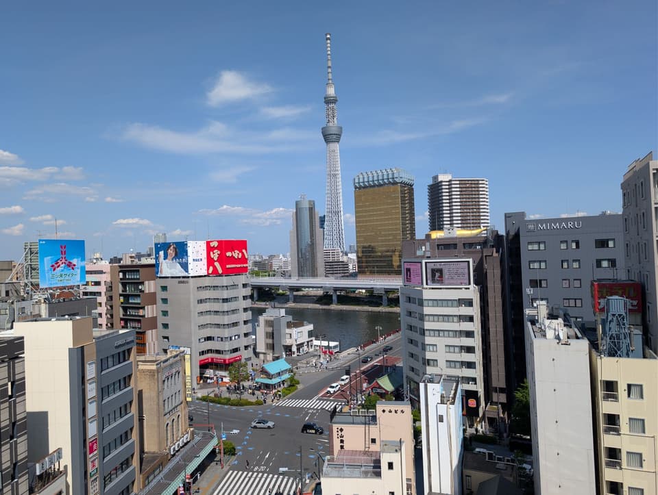 Vibrant urban skyline of Sumida City, Tokyo with the iconic Tokyo Skytree.