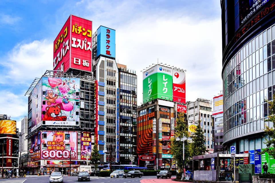 Colorful billboards and architecture in Akihabara, Tokyo on a bright day.